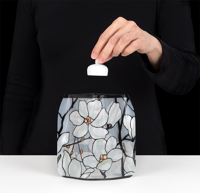 Drop in a water-activated  flameless LED floating  candle.